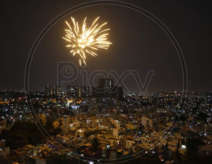 Fire Crackers Over Bangalore City Scape With Night City Lights