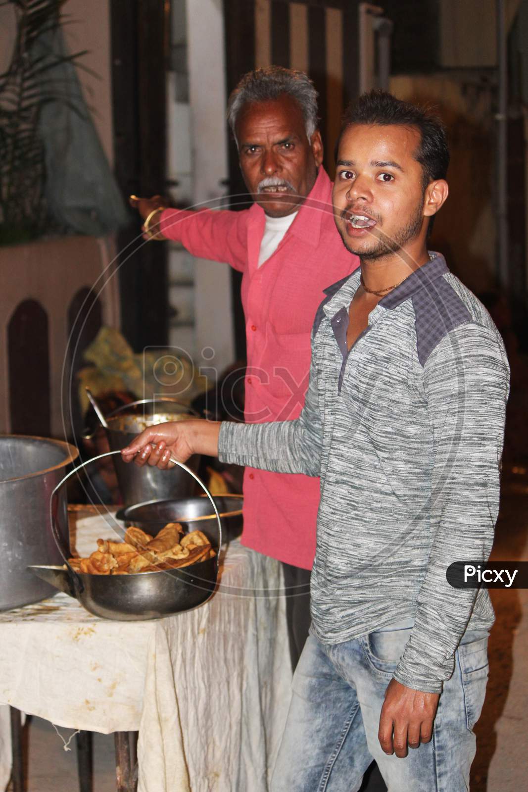 man distributing food for poor due to lockdown of corona virus