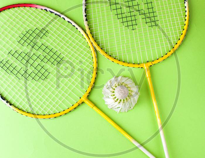 Badminton racket and white feather shuttle with stock isolated image.