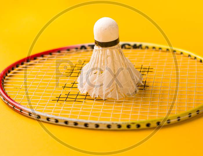 Badminton racket  with a white shuttlecock stock isolated image.