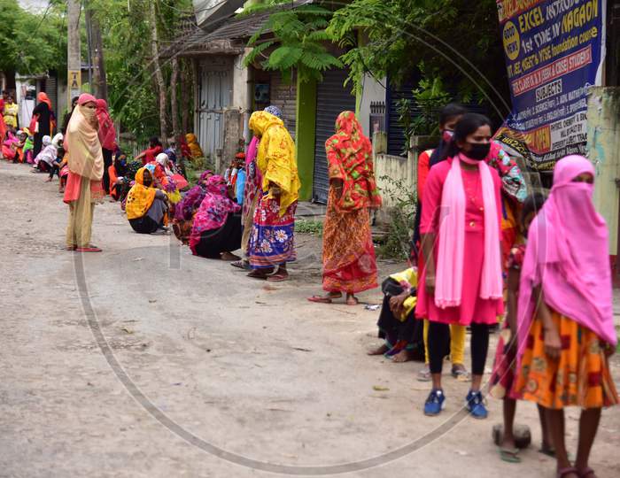 Women Wait For Their Turn To Collect 500 Indian Rupees  From A Bank'S Customer Service Point   During A Nationwide Lockdown In The Wake Of Corona virus (COVID-19) Pandemic,  In Nagaon District Of Assam On  Tuesday, April 21, 2020.