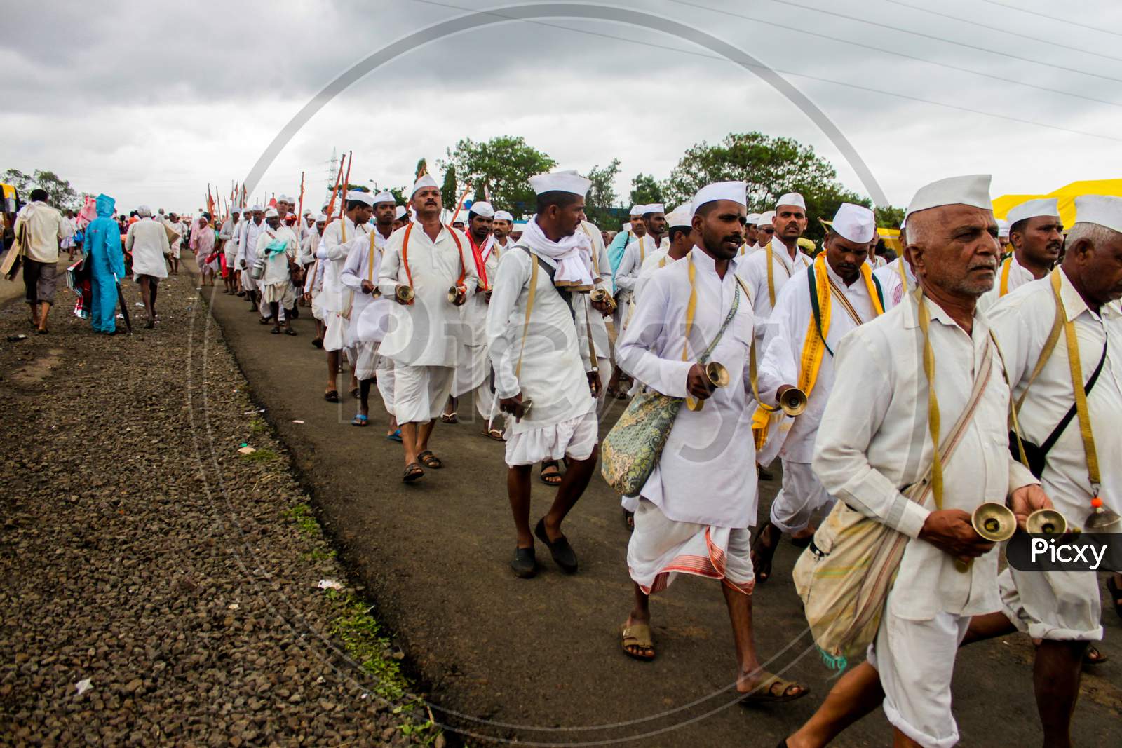 Maharashtrian People Walking The Pilgrimage And Dancing And Singing Devotional Songs
