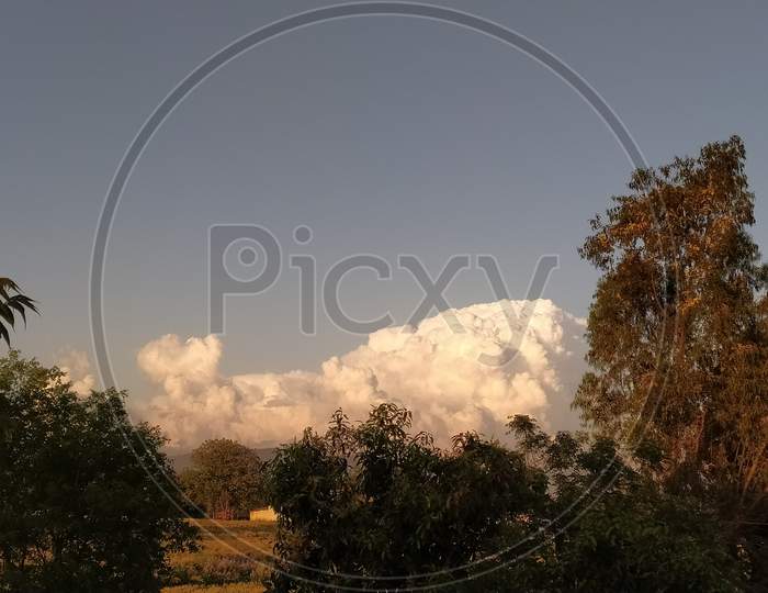 Cotton Clouds on Blue Sky Background