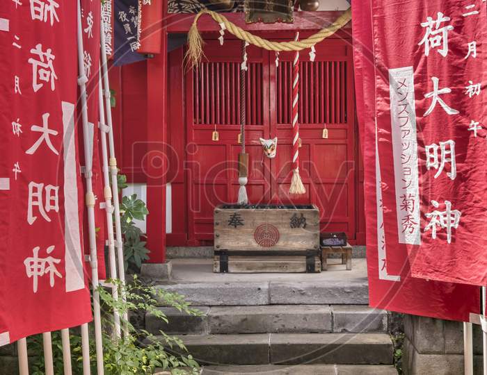 Small Shinto Santuary dedicated to the Uga-no-Mitama divinity meaning "the spirit of the rice in storehouses" which is associated with food and agriculture and which is often represented in the form of the fox Inari the divinity of rice.