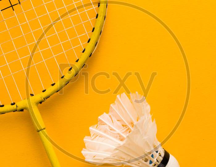 Badminton racket  with a white shuttlecock stock isolated image.