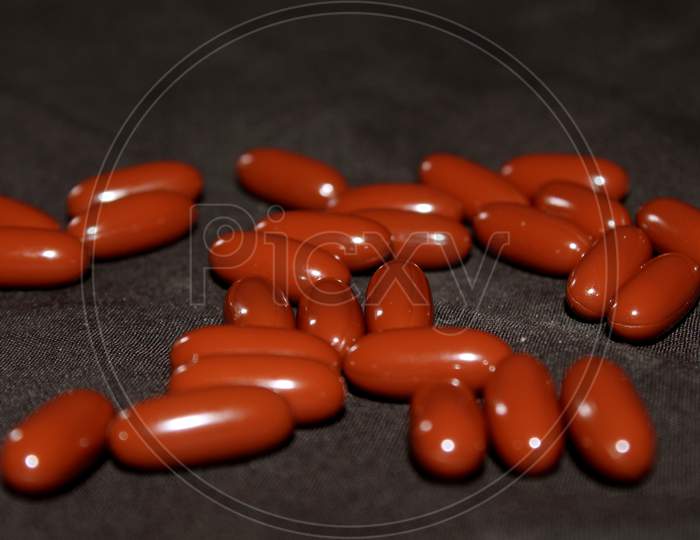 Capsules Or Pills On a Grey Surface