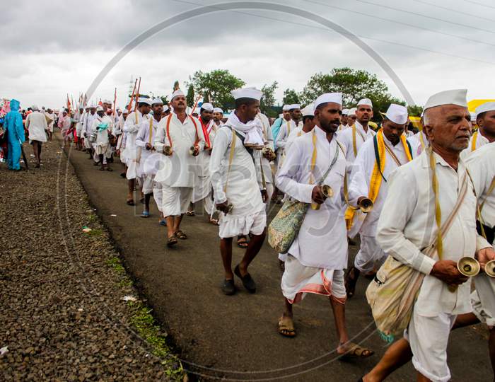 Maharashtrian People Walking The Pilgrimage And Dancing And Singing Devotional Songs