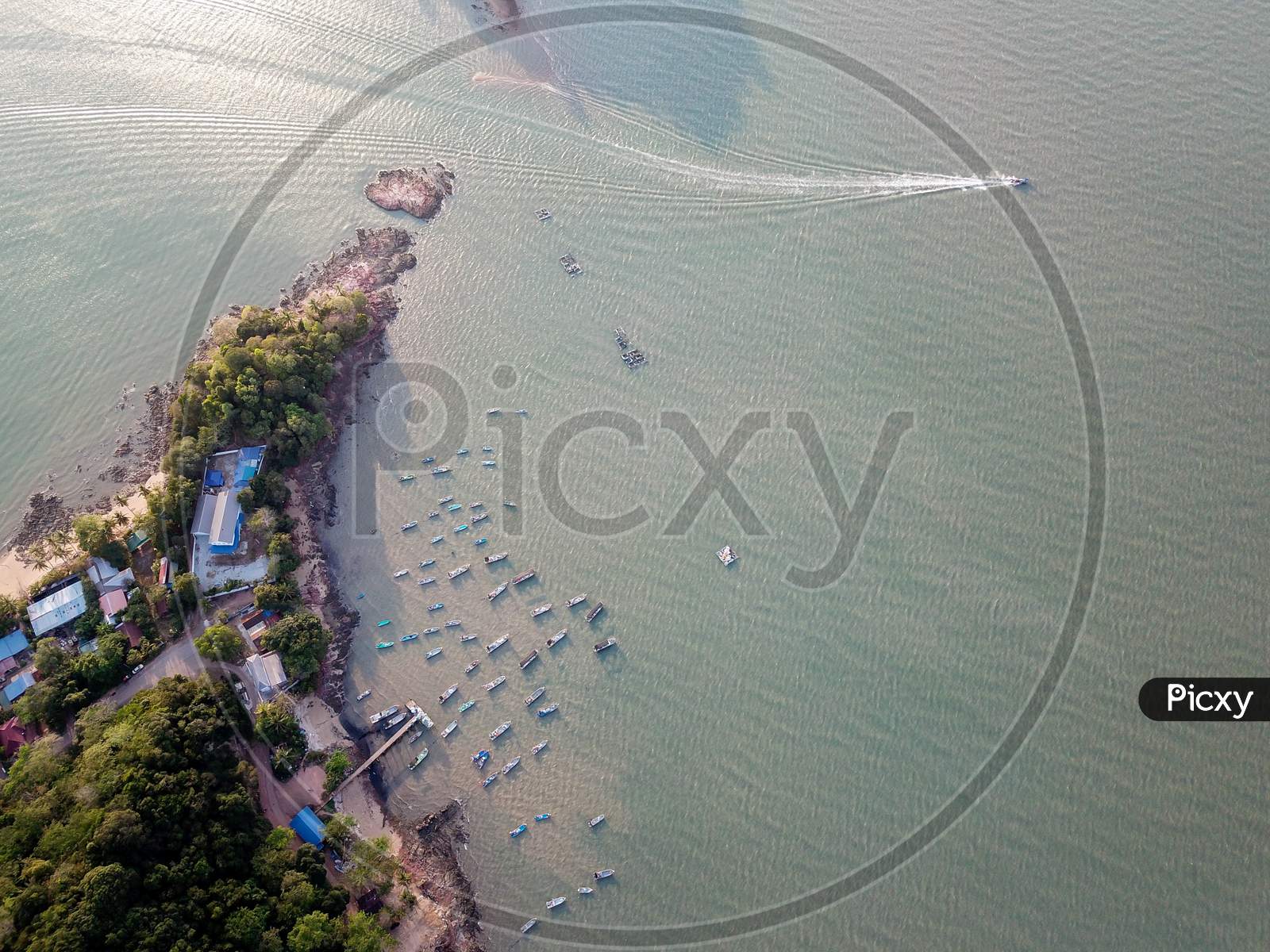 Aerial View Boat Moving At Fishing Village In Evening.