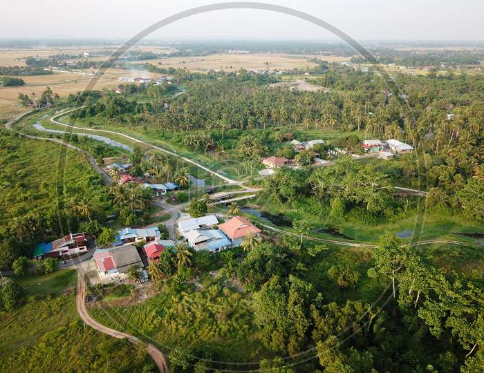 Malays Village Surrounded With Green Trees.