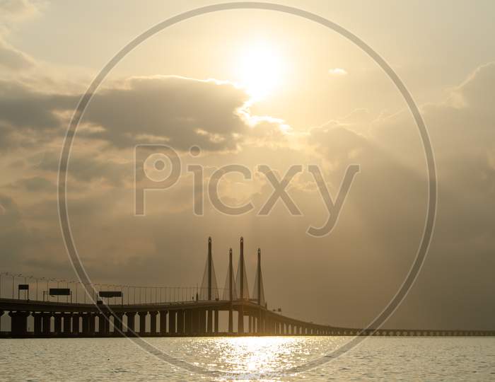 Penang Second Bridge With Golden Cloud And Sunray In Morning.