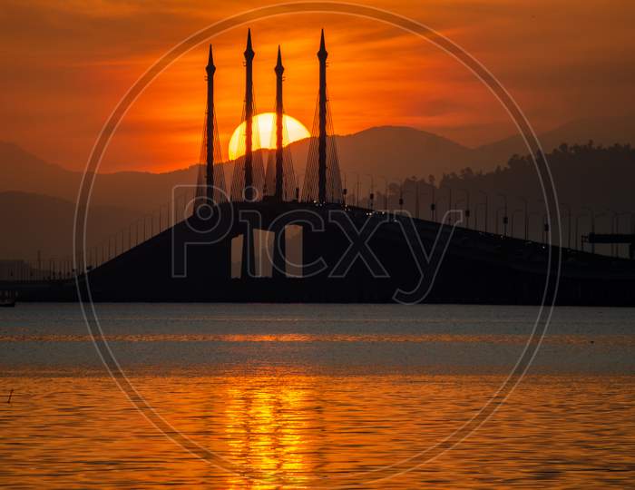 Reflection Of The Sun In Sea At Penang Bridge.