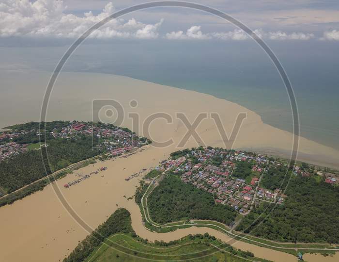 Aerial Brown Color Sungai Muda River At The Border Of Penang And Kedah.