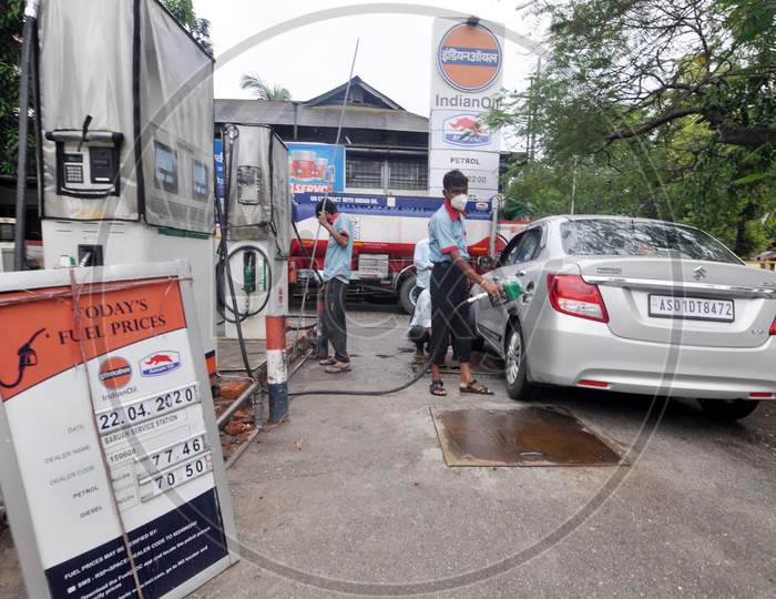 A Worker Refilling Petrol On A Car  At A Petrol Station During A Nationwide Lockdown Imposed Pandemic In Guwahati On April 22, 2020.