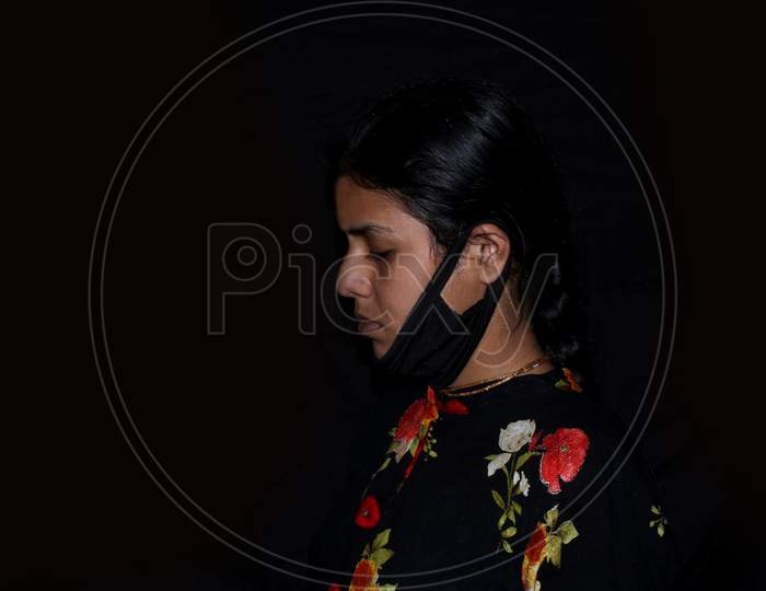 portrait of covid 19 infected sad woman in dark background