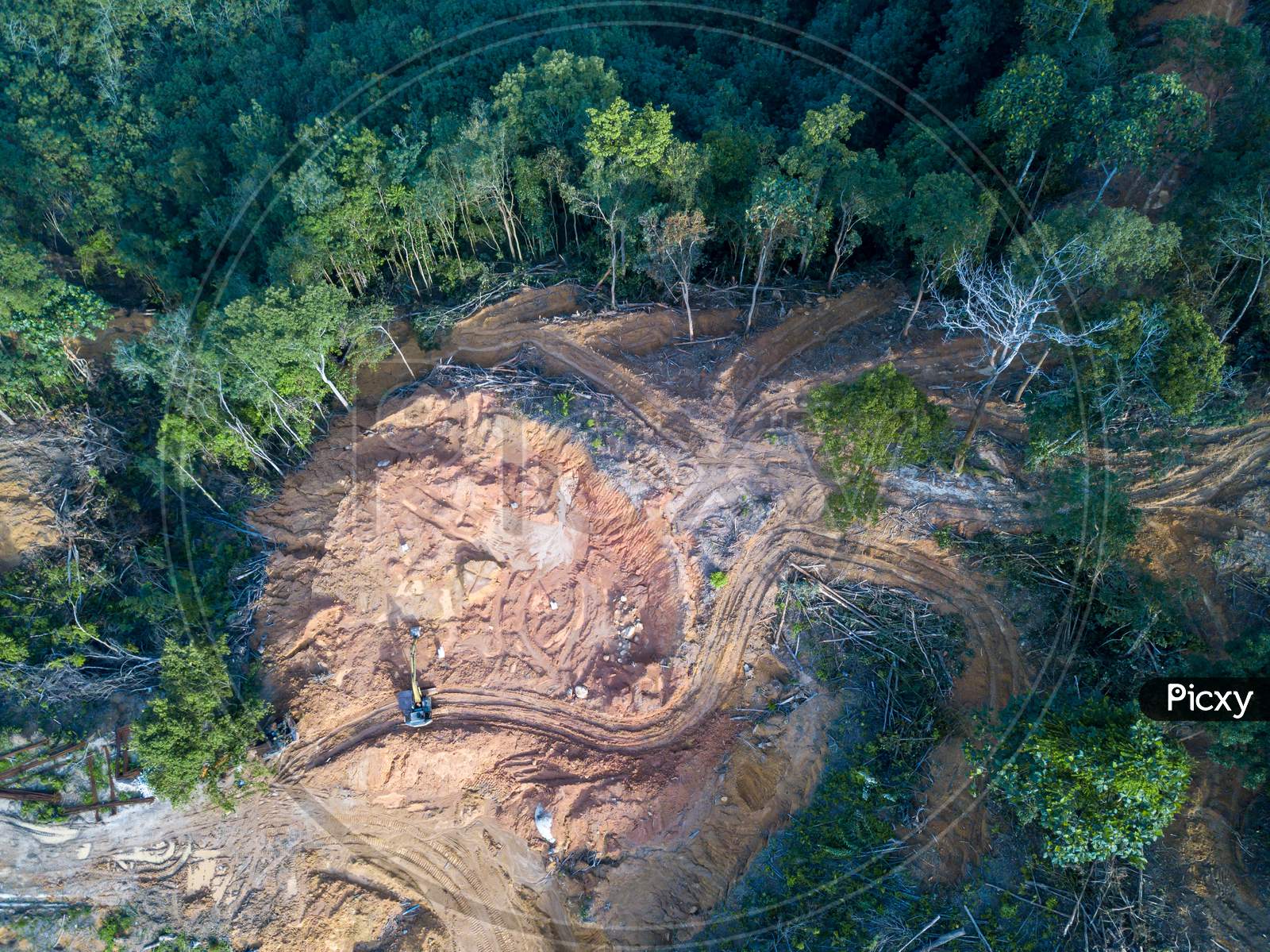 Aerial View Look Down Excavator And Land Clearing At Forest.