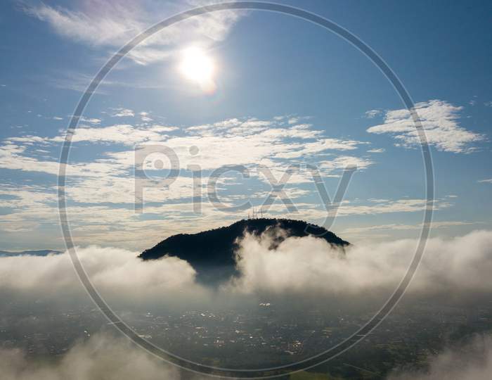 Aerial View Cherok Tokkun Hill In Afternoon Over Sea Cloud.
