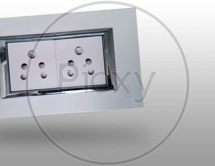Indian style electric socket with auto shutter and shiny steel strip for wall fitting made with bakelite plastic insulator and consist of two socket -isolated image