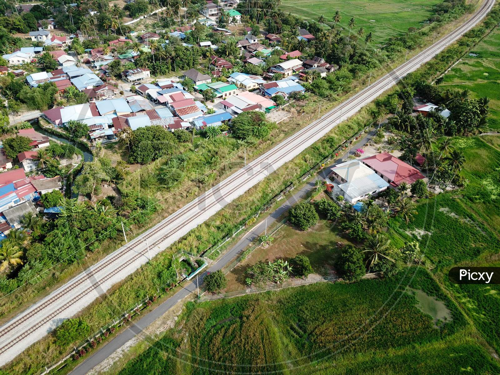 Drone View Malays Village Beside Railway.