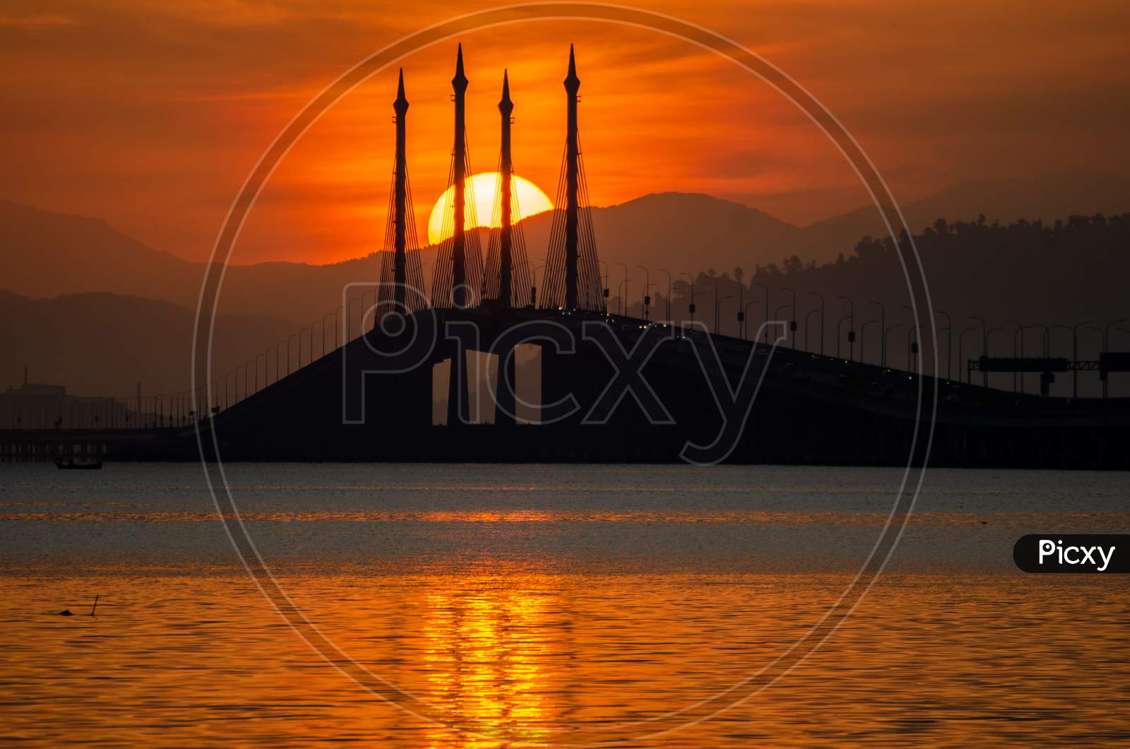 Reflection Of The Sun In Sea At Penang Bridge.