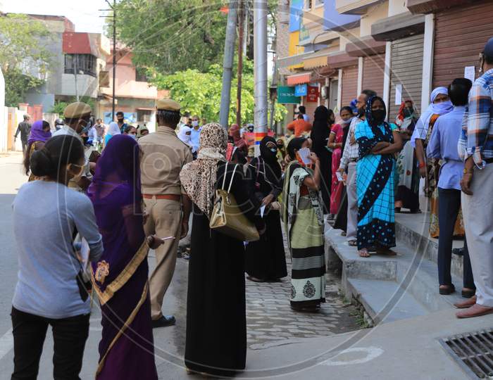 Woman Waiting in Queue Outside A Bank For Withdrawing Money  During Nationwide Lockdown Amidst Coronavirus or COVID-19 Outbreak in Prayagraj