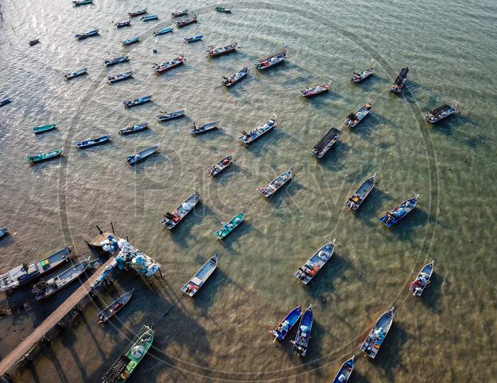 Fishing Boats In Row At Jetty.