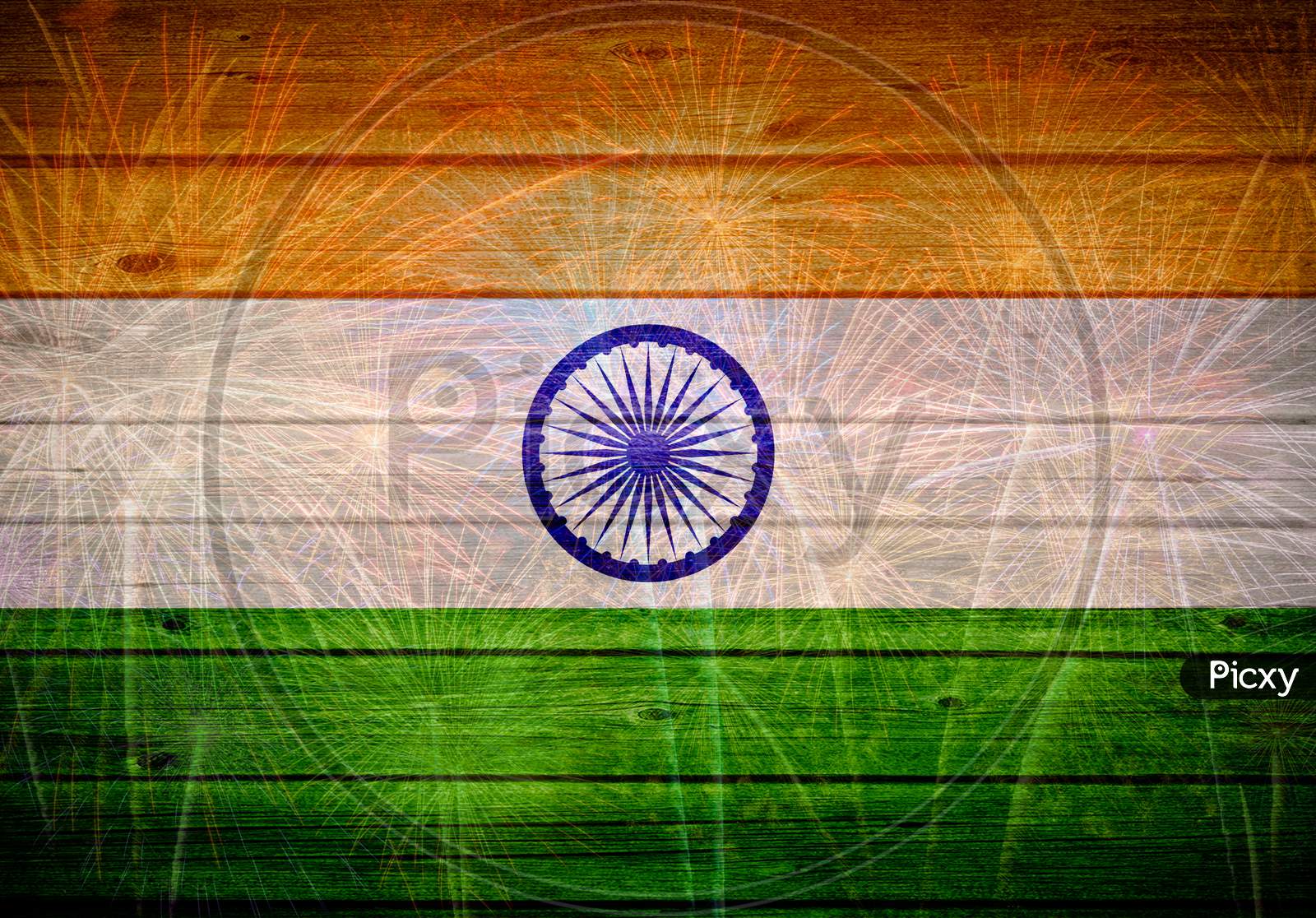 Indian flag painted on wooden texture with fireworks background
