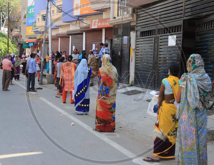 Woman Waiting in Queue Outside Bank For Money Withdraw During Nationwide Lockdown For Coronavirus Or COVID-19 Outbreak in Prayagraj