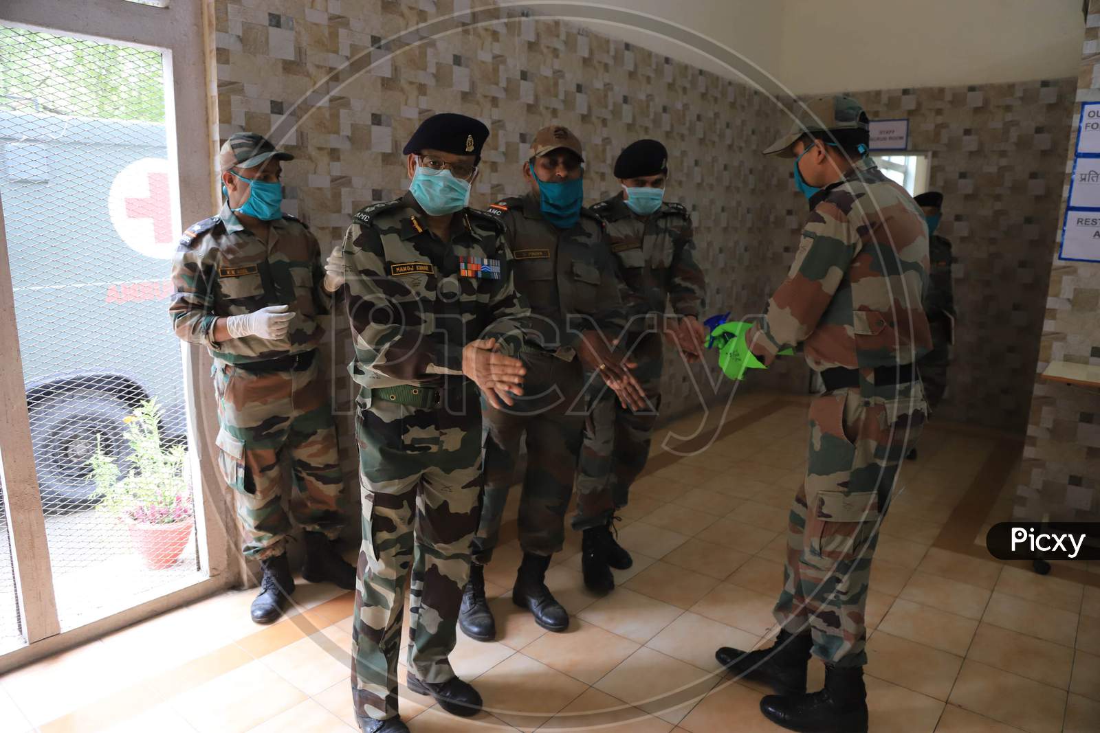 Indian Army Soldiers Sanitizing Hands Before Entering To a COVID-19 Or Coronavirus Patient Ward At a Hospital In Prayagraj, April,23, 2020