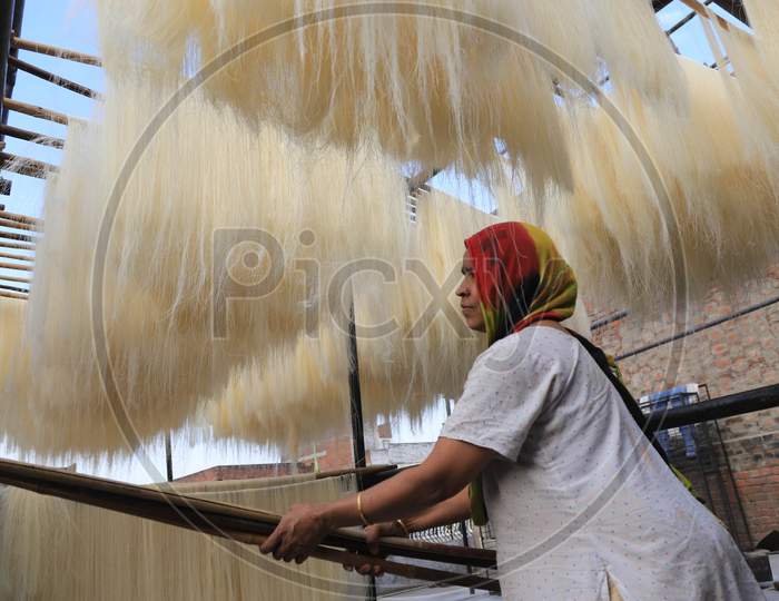 A Woman Spread Strands Of Vermicelli At a Factory For Ramadan Or Ramazan in Prayagraj