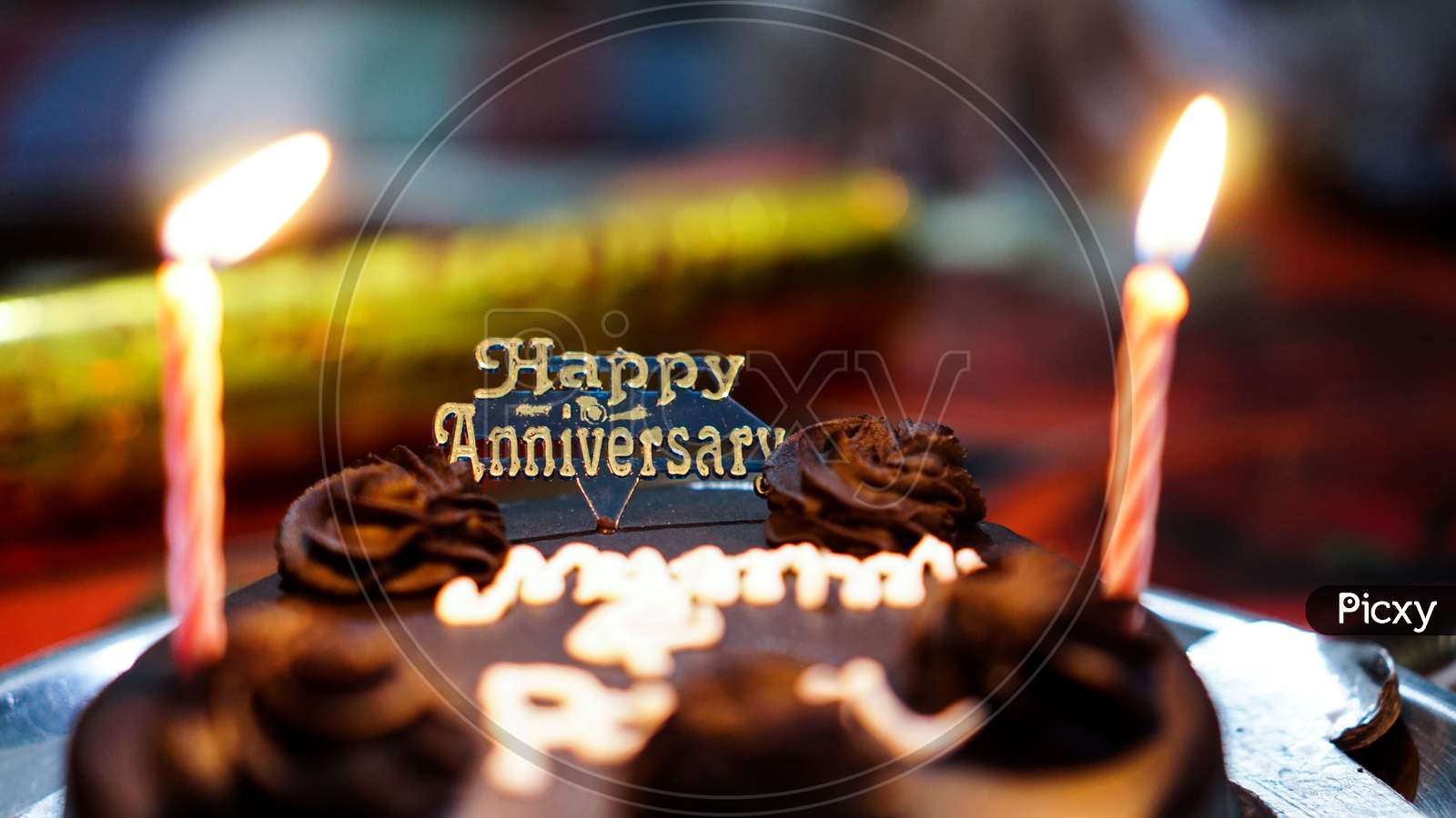 Celebrating Wedding Anniversary With Heart Shape Chocolate Cake. Stock  Photo, Picture And Royalty Free Image. Image 27408151.