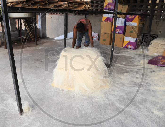 A Man Carries Strands of Vermicelli in a Factory For Ramdan Or Ramzan Season