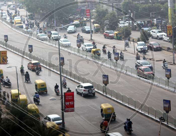 developed city road traffic with vehicle and Indian town