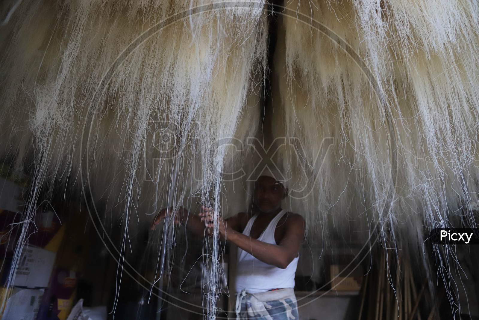 A Man Spread Strands Of Vermicelli in a Factory For Ramdan Or Ramzan Season