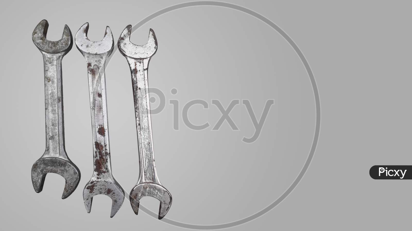 Old rusty iron or steel wrenches used to open nut or bolt in automobile repairing and for other industrial purposes -isolated image