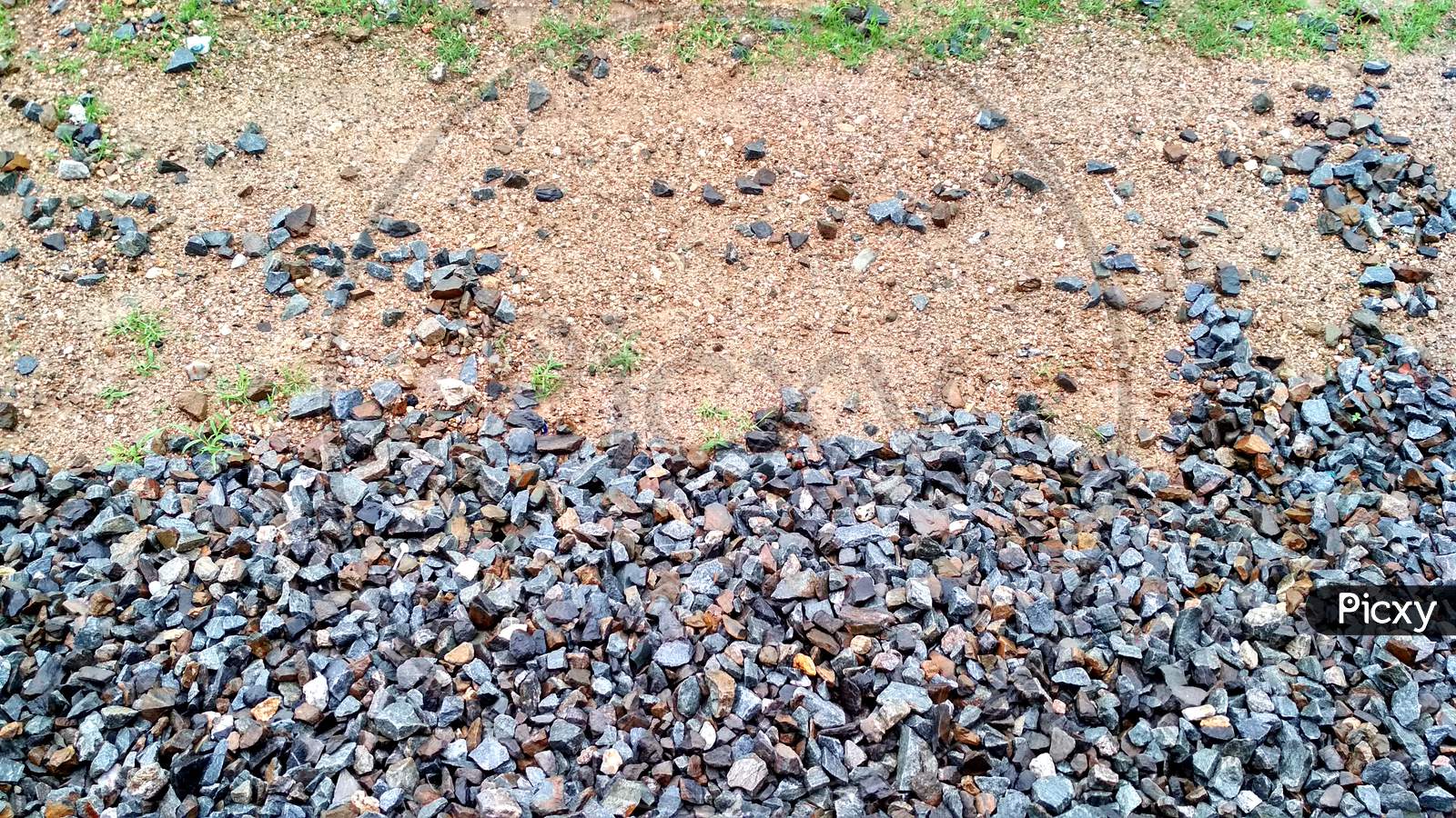 Rail Road Track Ballast Stone Gravel Close-Up As Background