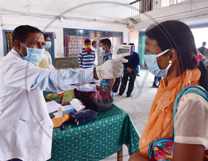 Doctor Examining Passengers At A.S.T.C Bus stand Before Boarding Buses During Nationwide Lockdown Amidst Coronavirus Or COVID-19 Outbreak In Nagaon Assam April 25 2020