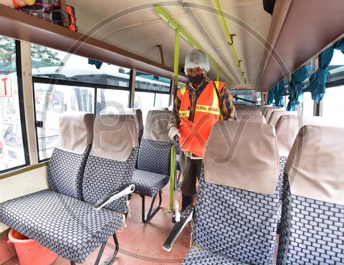 Municipal Workers Sanitizing Buses During nationwide Lockdown Amidst Coronavirus or COVID-19 Outbreak in Nagaon, Assam April 25 2020