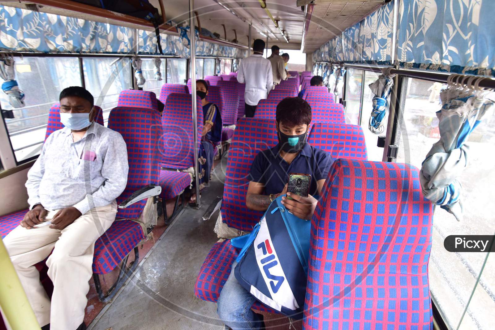 Passengers Travelling  To their Hometowns in Buses Arranged By A.S.T.C  During Nationwide lockdown Amidst Coronavirus or COVID-19 Outbreak in Nagaon Assam , April 25 2020