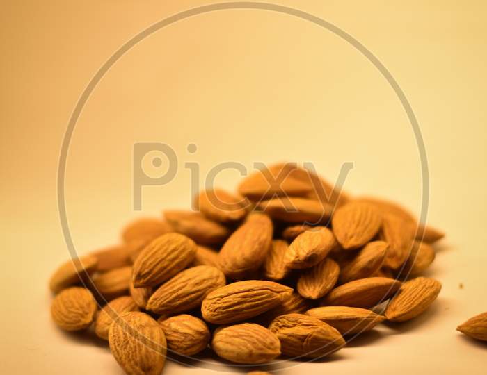 closeup of almonds on a white background
