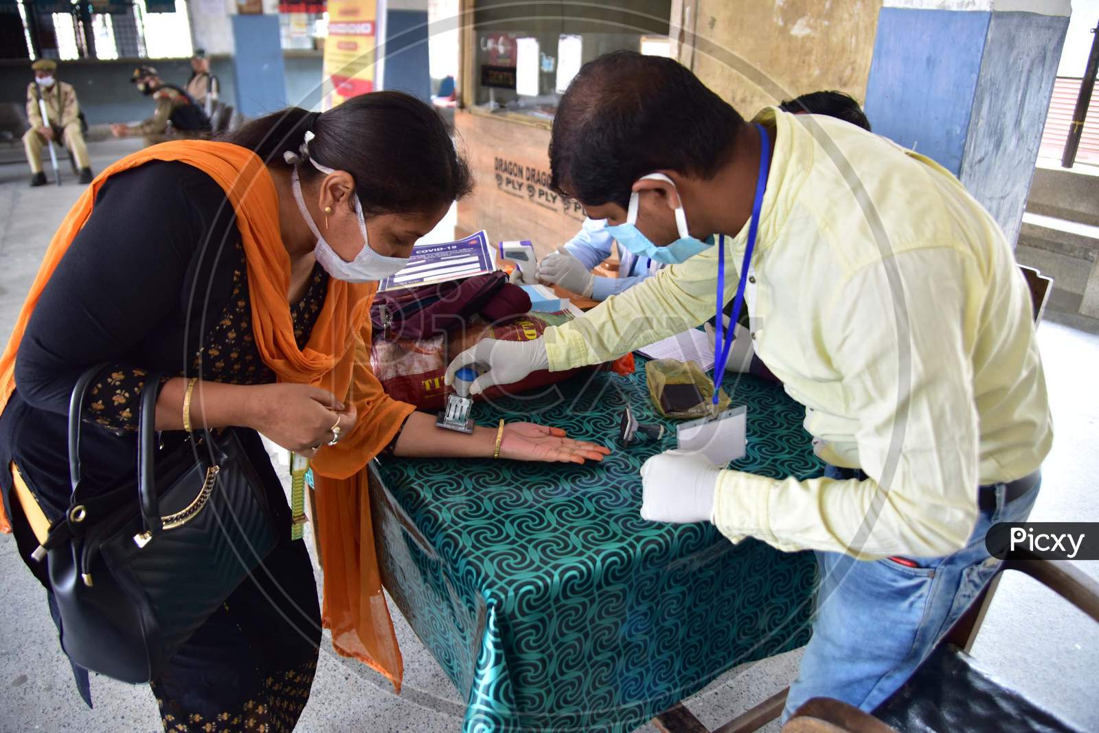 Doctors Stamping Passengers Hands After Medical Examination During Nationwide Lockdown Amidst Coronavirus or COVID-19 Outbreak in Nagaon Assam , April 25 2020