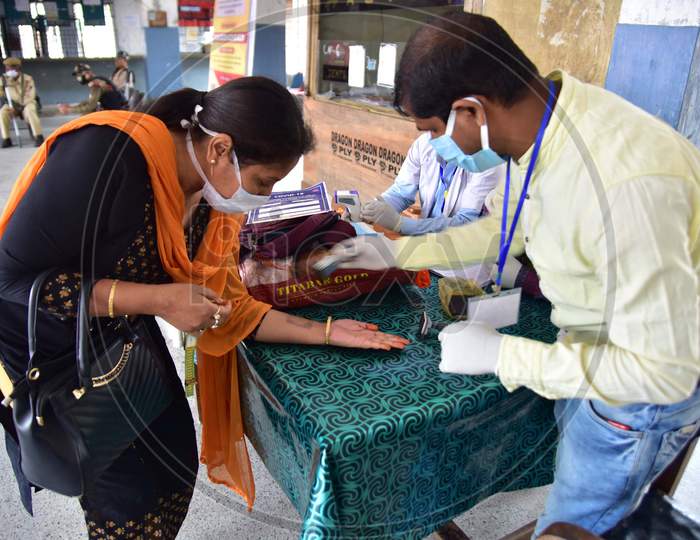 Doctors Stamping Passengers Hands After Medical Examination During Nationwide Lockdown Amidst Coronavirus or COVID-19 Outbreak in Nagaon Assam , April 25 2020