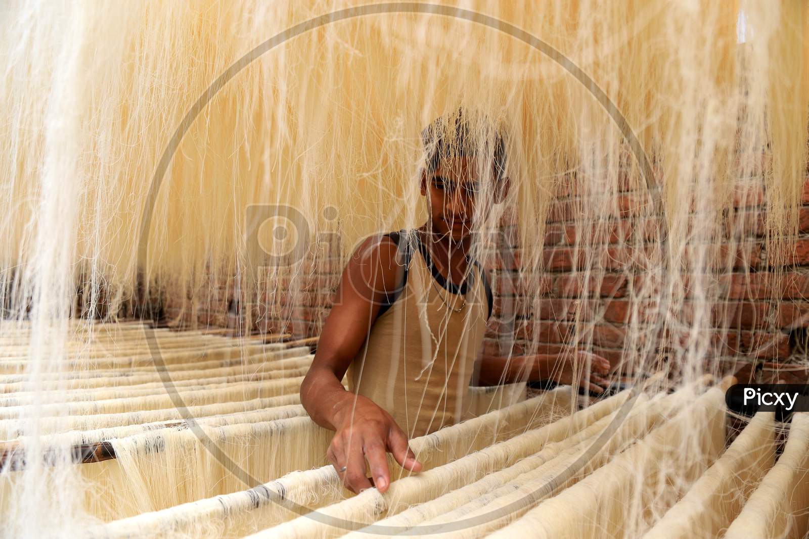 A Worker Drying Vermicelli in a Factory Ahead of Ramadan Or Ramazan  in Prayagraj