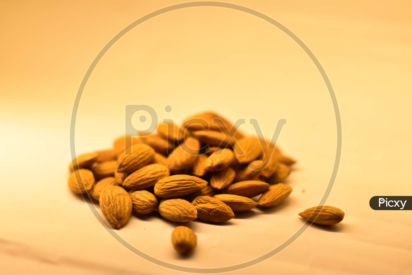 closeup of almonds on a white background