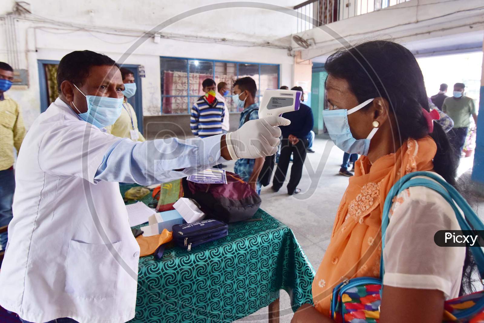 Doctor Examining Passengers At A.S.T.C Bus stand Before Boarding Buses During Nationwide Lockdown Amidst Coronavirus Or COVID-19 Outbreak In Nagaon Assam April 25 2020