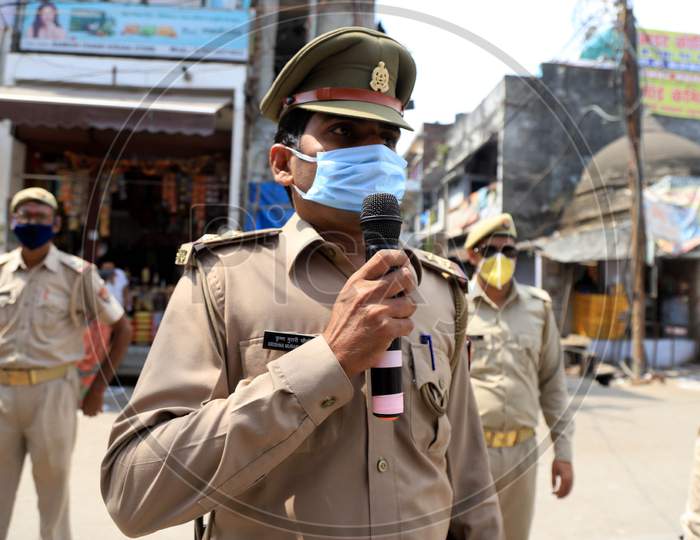 A Policeman Announcing To  Stay In Homes At  a Hot Spot Area  During Nationwide Lockdown Amidst  Coronavirus or COVID-19 Outbreak In Prayagraj, April 25 2020