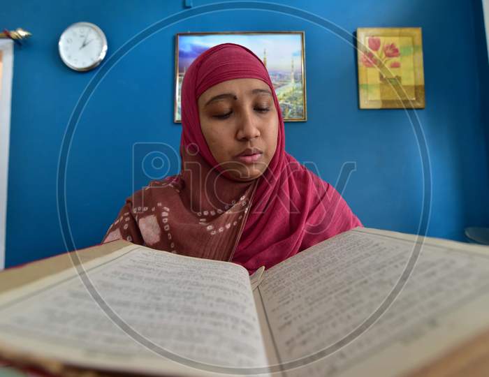 A Muslim Woman Reading The Holy Quran  on the First Day of Ramzan or Ramadan Month in Nagaon, Assam April 25 2020