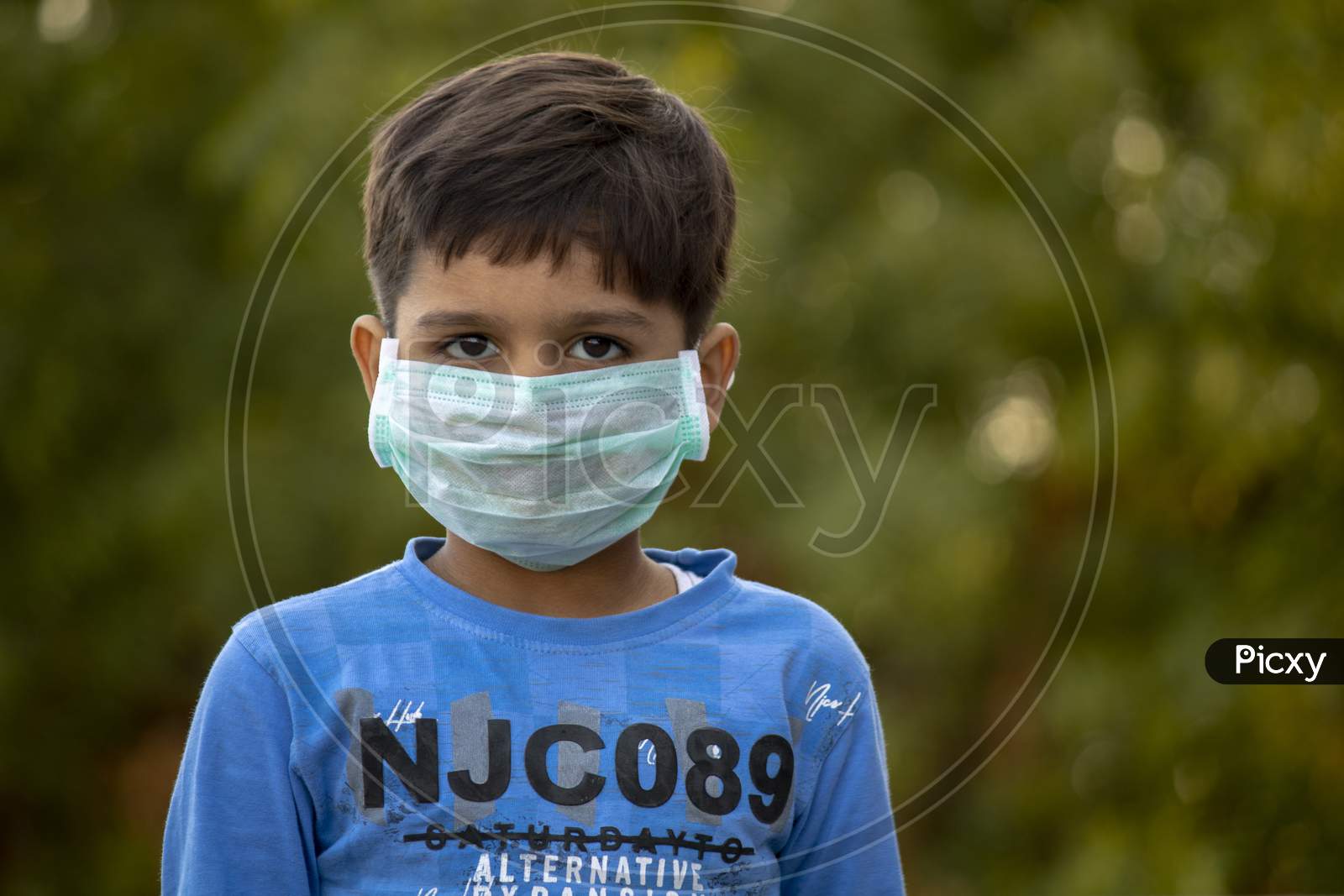 Indian Child With Mask On His Mouth For Protection From Corona Virus