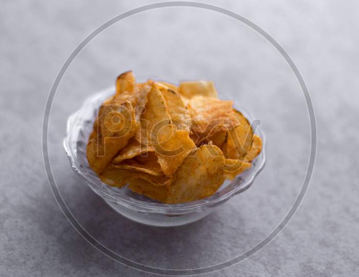 Potato Chips  In a Bowl On an Isolated Grey Background