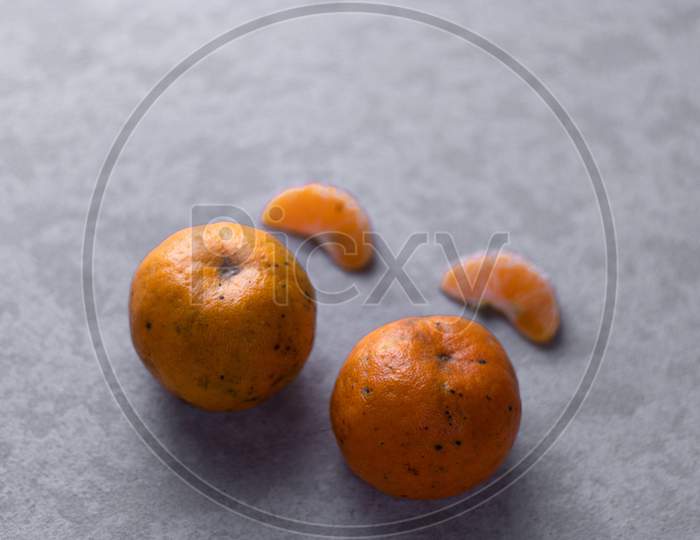 Orange Pieces On Grey isolated Background
