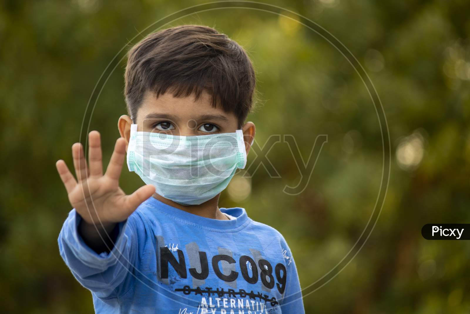 Indian Child With Mask Showing Five Fingers For Do The Five Tips Protecting From Corona Virus